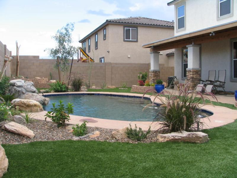 Artificial Turf Landscape surrounding swimming pool