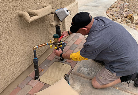 Irrigation Repair By Man Of The Soil